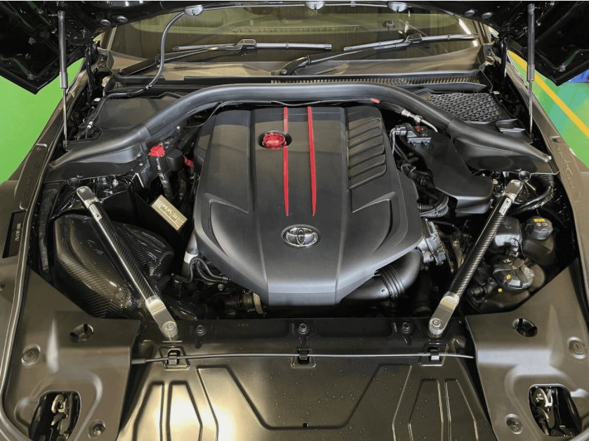 A90 MK5 Supra HKS Carbon front strut bars.